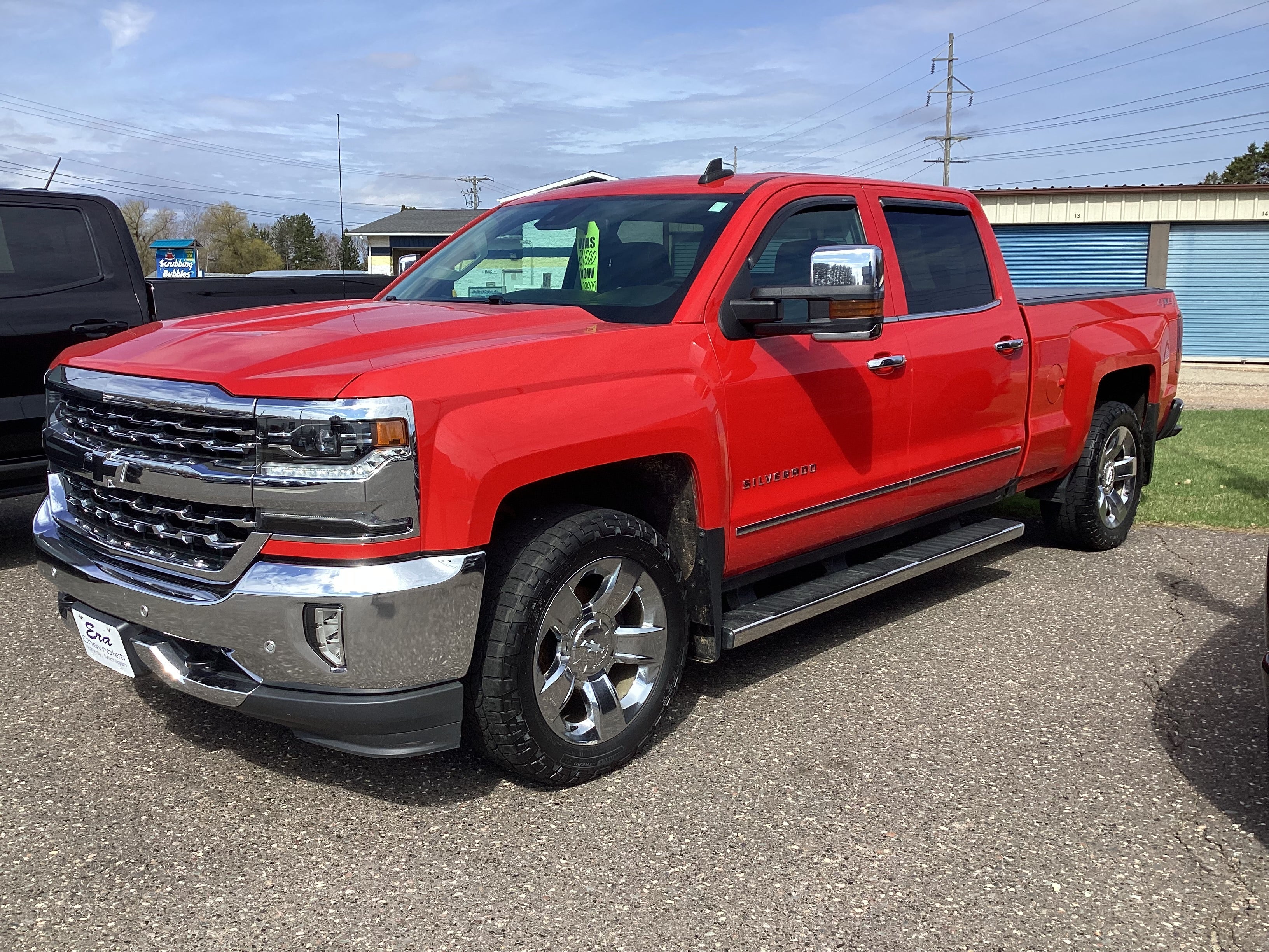 2018 Chevrolet Silverado 1500 LTZ in Red Hot — front three-quarter view